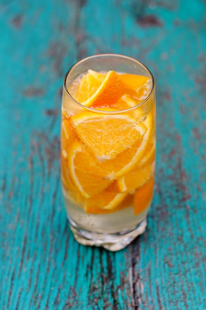 Mineral water with pieces of orange 