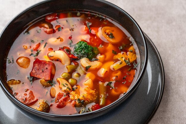 Minestrone Soup is a thick soup of Italian origin made with vegetables and pasta