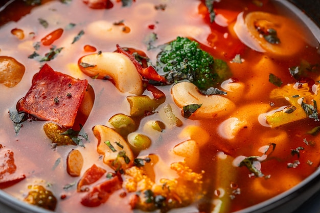 Minestrone Soup is a thick soup of Italian origin made with vegetables and pasta