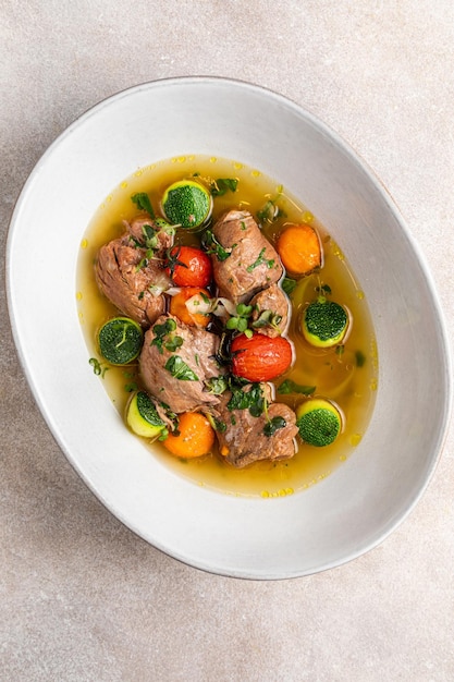 Minestrone suop with croutons Vegetable cream soup and wooden background