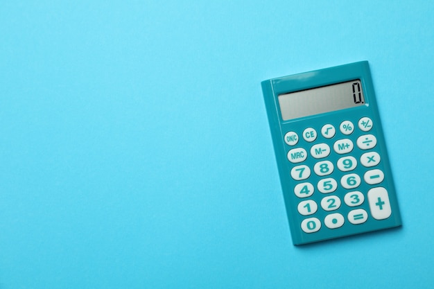 Mini calculator on blue background, space for text