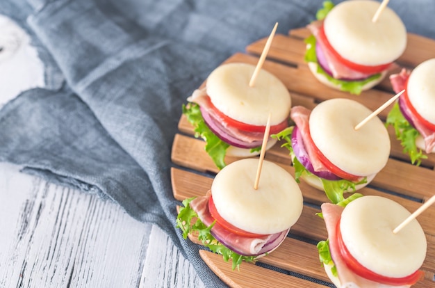 Mini cheese and prosciutto sandwiches