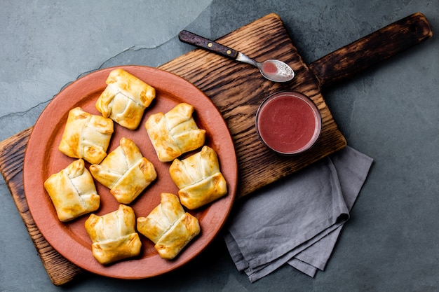 Mini Chilean empanadas on clay plate