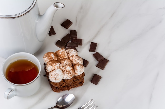 Mini chocolate cake and cup of tea.