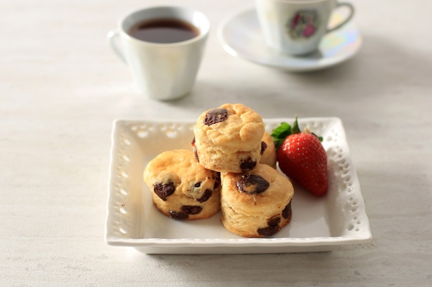 Mini Chocolate Cranberry Scone for Tea Party. Seved with Tea, Copy Space for Text