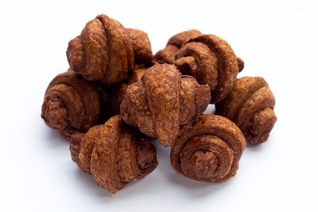 Mini chocolate croissant on white background.