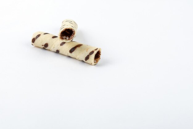 Mini Chocolate vanilla waffle tube biscuit on white background