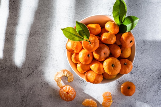 mini clementines on a gray background