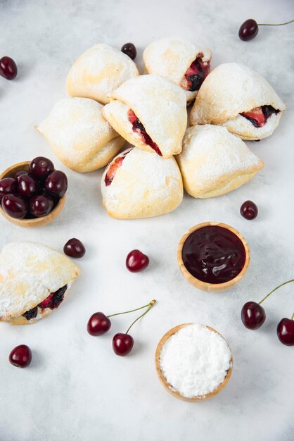 Mini Cookies with cherry on grey background