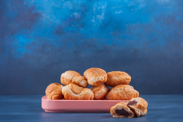 Mini croissants made of puff pastry with a golden crust . 