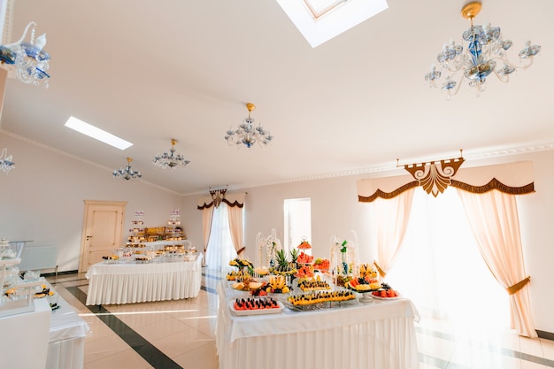 Mini cupcakes and candy bar on  wedding reception.