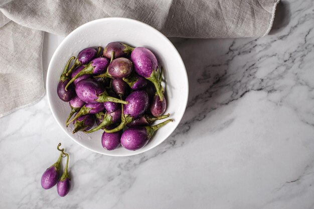 mini eggplant on a light background