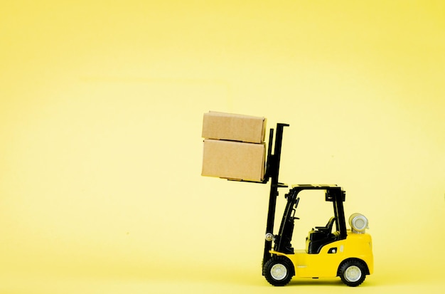 Mini forklift truck load cardboard boxes. Logistics and transportation management ideas and Industry business commercial concept.