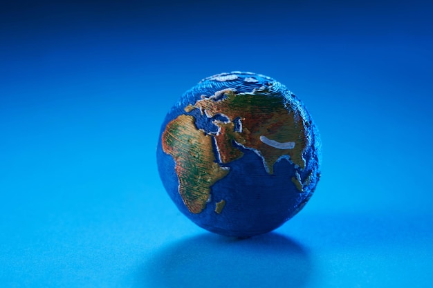 Mini globe showing asia on blue background