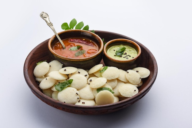 Mini idli is the smaller version of soft and spongy round shaped steamed regular rice idli also known as button and cocktail idly