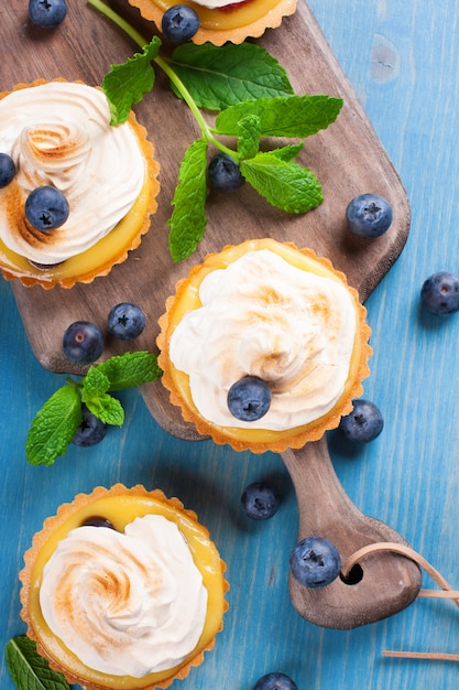 Mini lime curd tartlets with meringue.