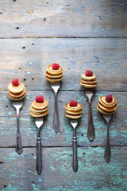 mini pancakes on a wooden table