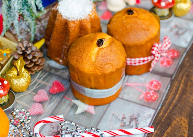 Mini panettone and pandoro, with fruits and Christmas decoration,