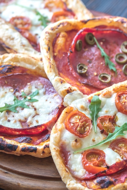 Mini pizzas on the wooden board