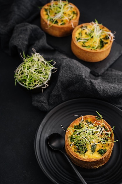 Mini quiche with herbs on plate