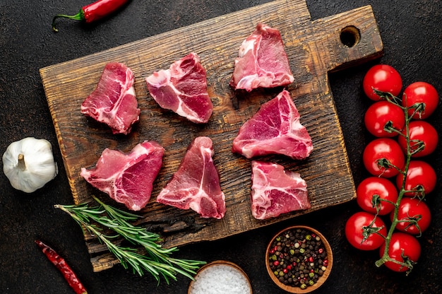 mini raw Beef T-Bone steak on stone table