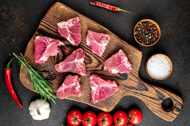 mini raw Beef T-Bone steak on stone table