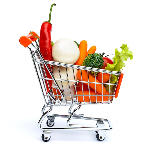 Mini shopping cart full with vegetables