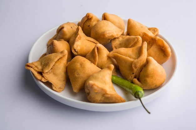 Mini or small samosa with sauce and hot tea