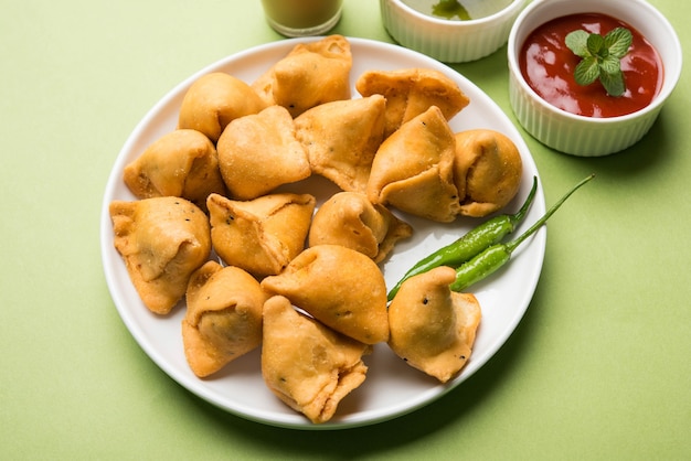 Mini or small samosa with sauce and hot tea