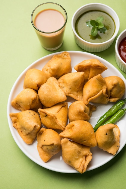 Mini or small samosa with sauce and hot tea