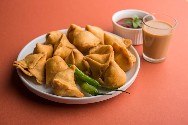 Mini or small samosa with sauce and hot tea