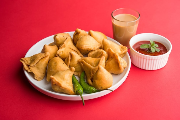 Mini or small samosa with sauce and hot tea