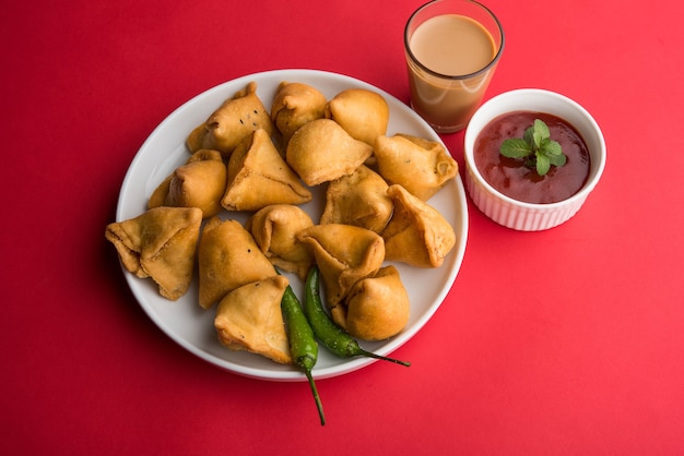 Mini or small samosa with sauce and hot tea