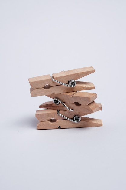 Mini spring clothespins on white background