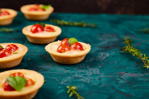 Mini tarts with cherry tomatoes