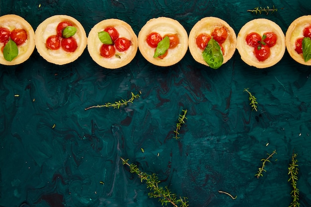 Mini tarts with cherry tomatoes