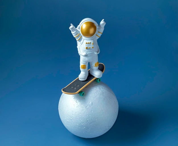 Miniature astronaut figurine on a skateboard International Day of Human Space Flight concept