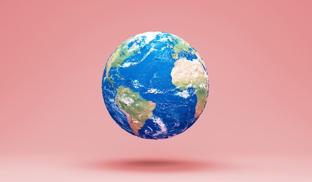 Photo miniature earth planet on pink studio background