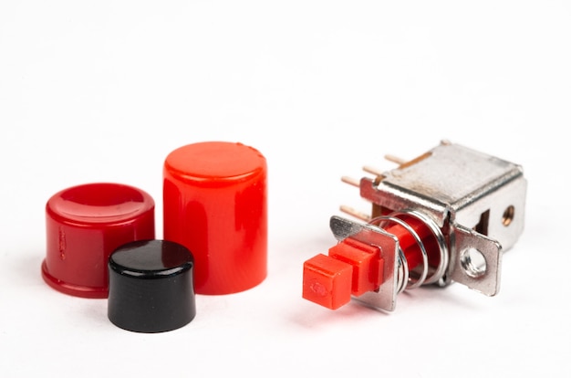 Miniature electric switches with red caps isolated