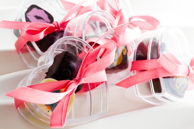 Miniature hear shaped boxes filled with gourmet truffles.