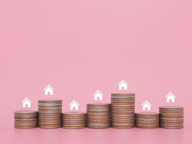 Miniature house icons and stack of coins The concept of saving money for house manage time to Property investment House mortgage Real estate