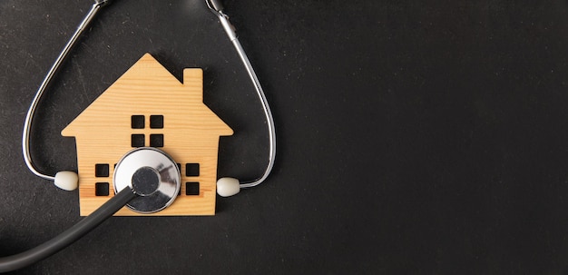 Miniature house and stethoscope