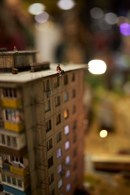 Miniature houses made by hand Pieces of people and cars Houses closeup