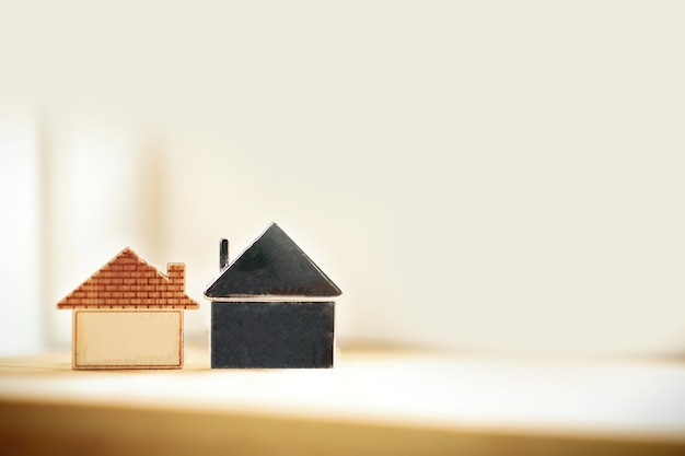 miniature little wooden house for property,mortgage,investment real estate concept with copy space 