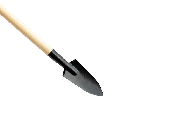 Miniature narrow shovel on isolated white background