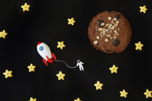 Miniature people Astronaut floating in galaxy