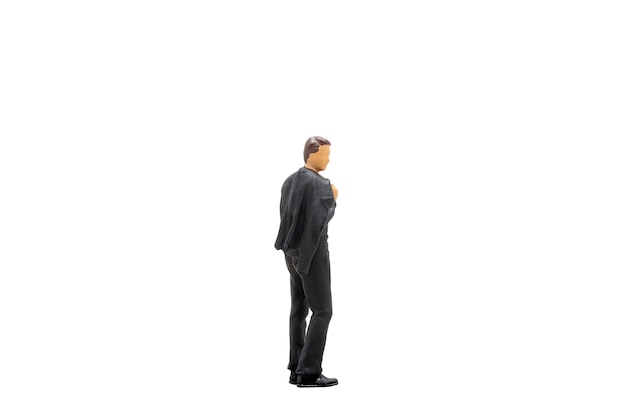 Miniature people Businessman standing isolated on white background with clipping path