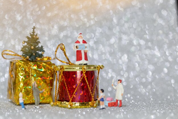 Miniature people happy family celebrating a christmas christmas and happy new year concept