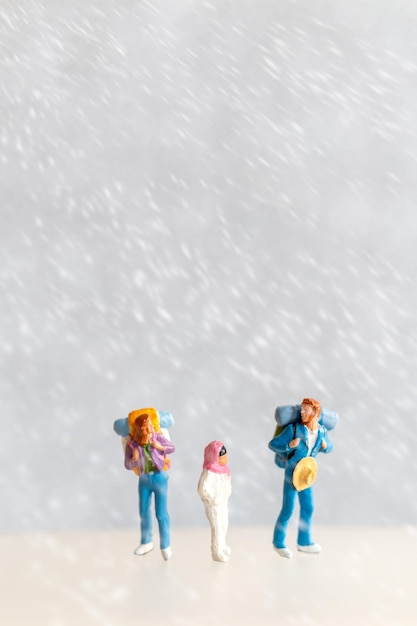 Miniature people Happy family Travel in winter time