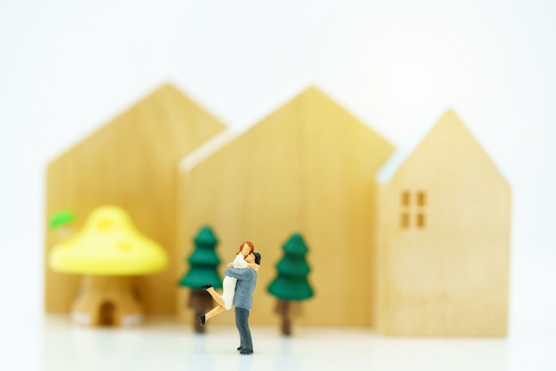 Miniature of people Lover standing with house